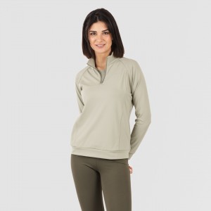 Camisola desportiva mulher com fecho de correr e bolsos verde folha