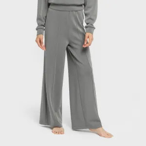 Calças compridas fluidas com pregas mulher