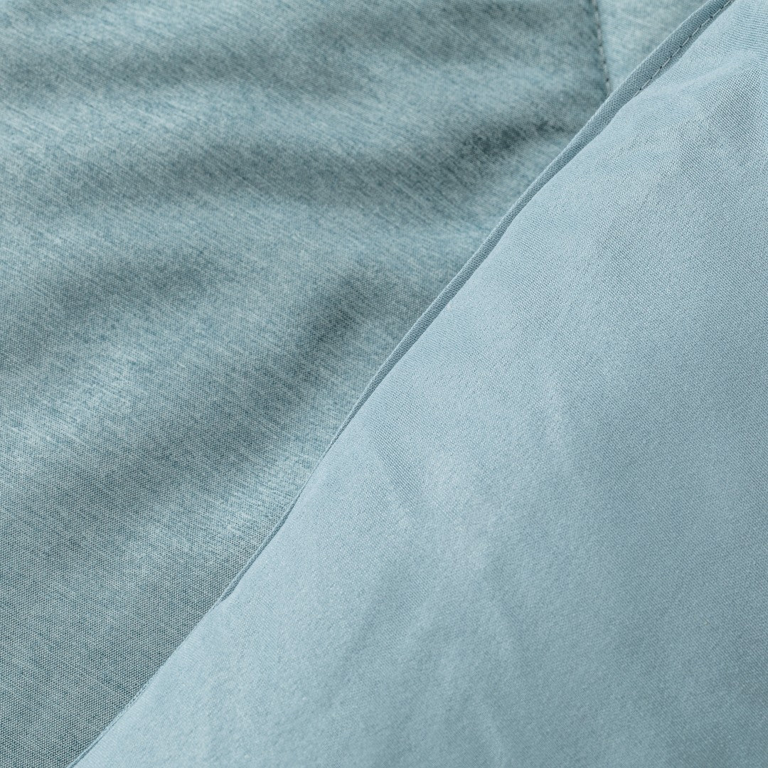 Edredom liso com efeito desgastado