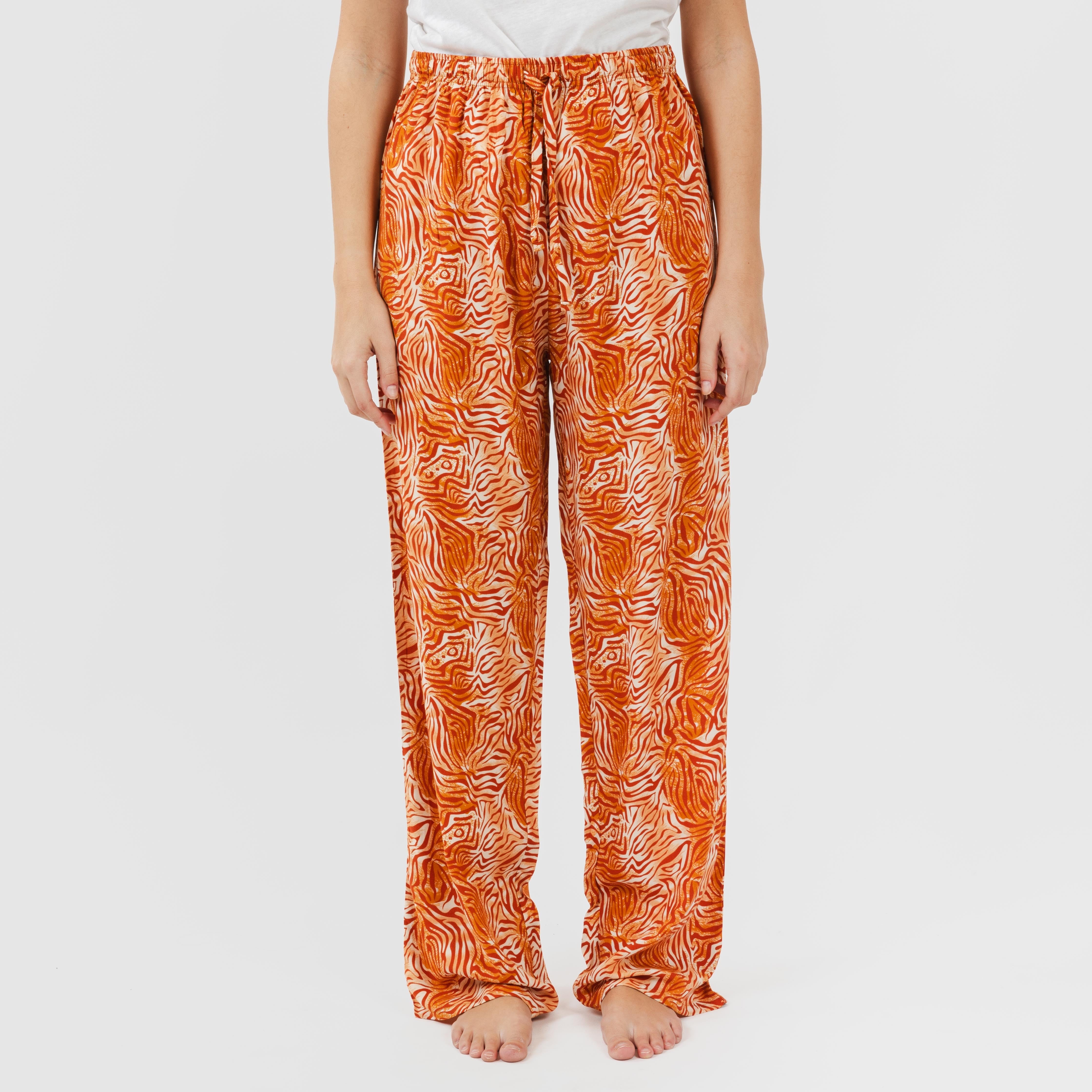 Calças de viscose. Sola cor terracota.