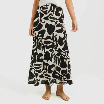 Saia de viscose para o meio do dia, bege e preta, da Teudis.