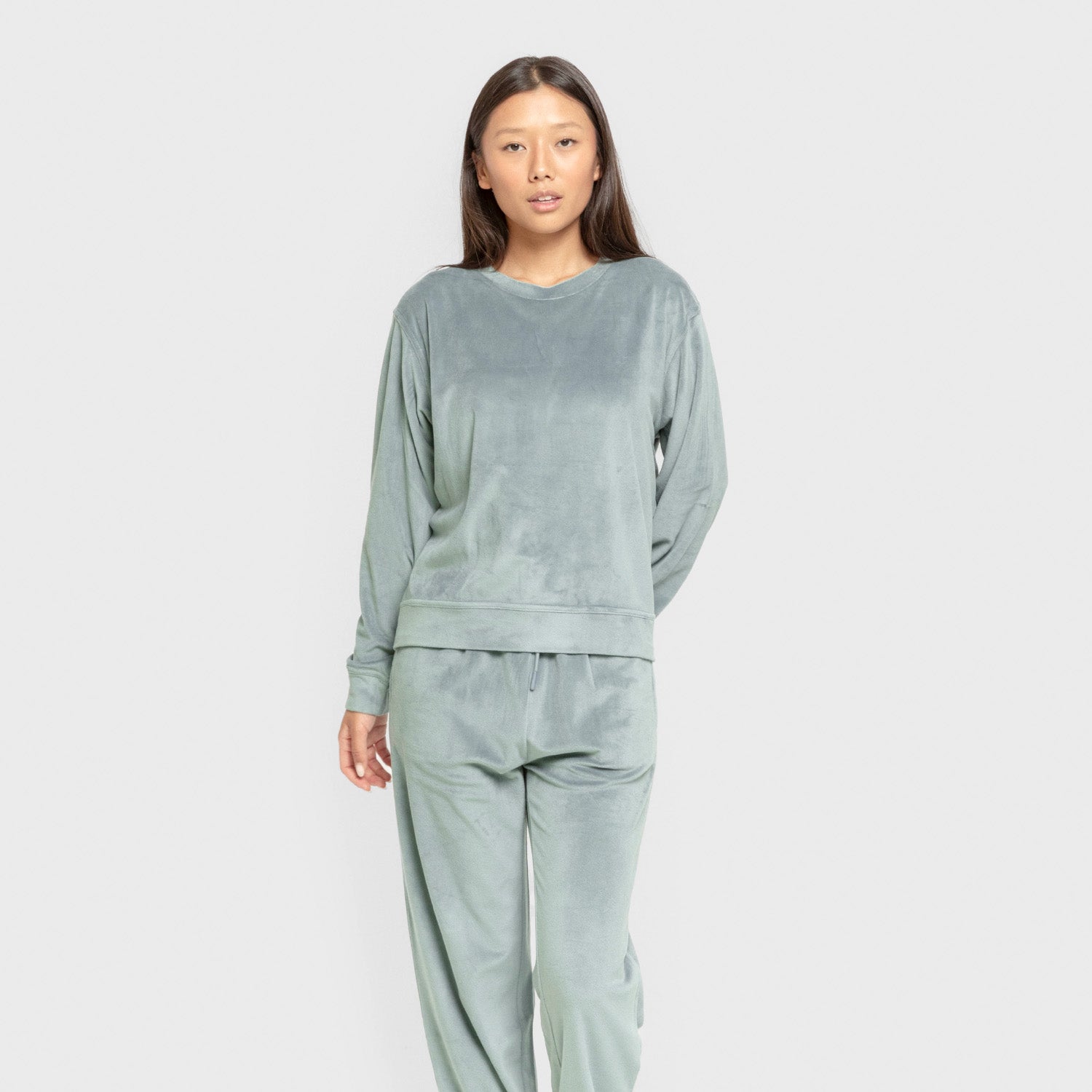 Pijama de veludo liso super macio na cor azul-turquesa.