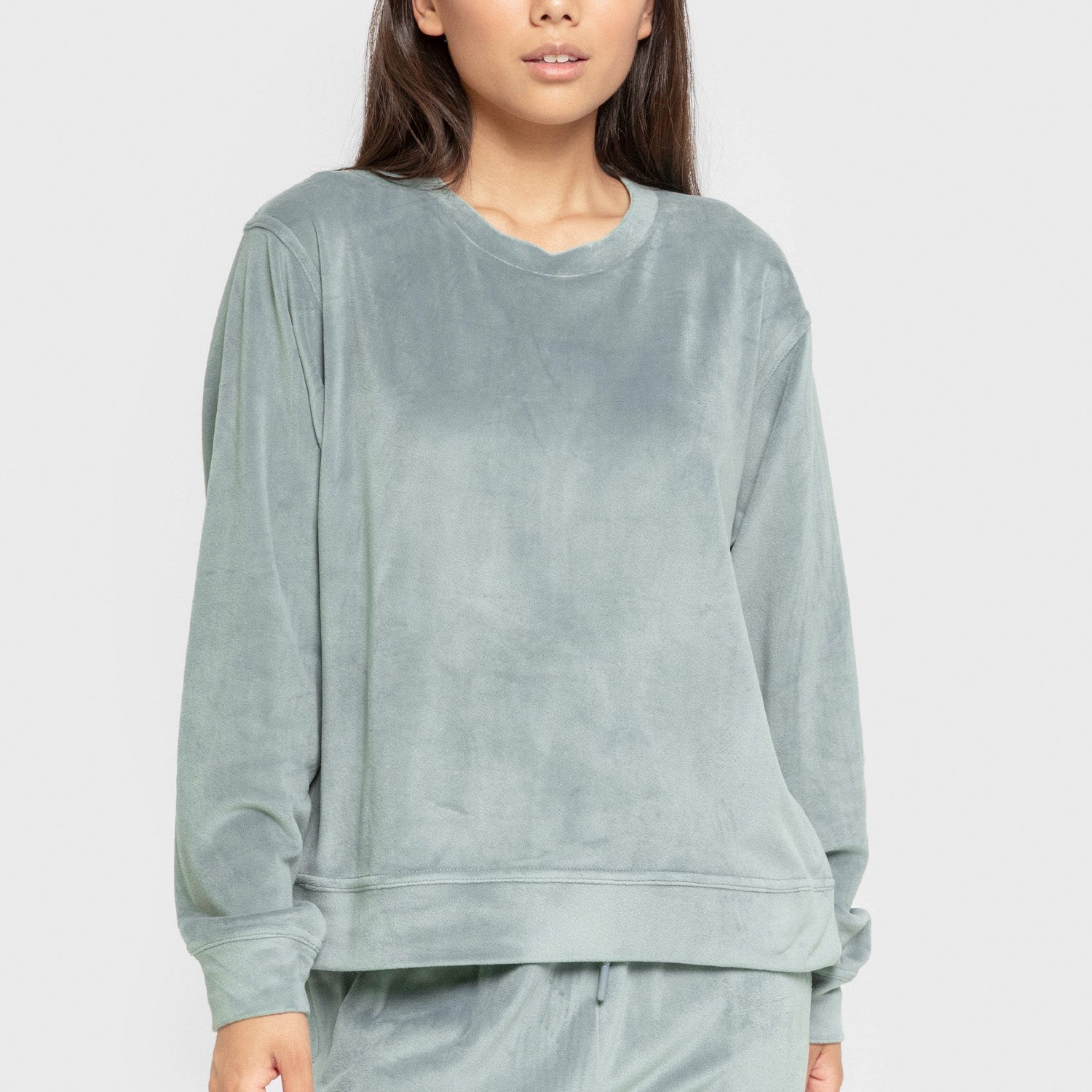 Pijama de veludo liso super macio na cor azul-turquesa.